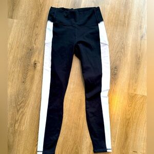 Fabletic’s High Waist Power Hold leggings. Black and white with side pockets